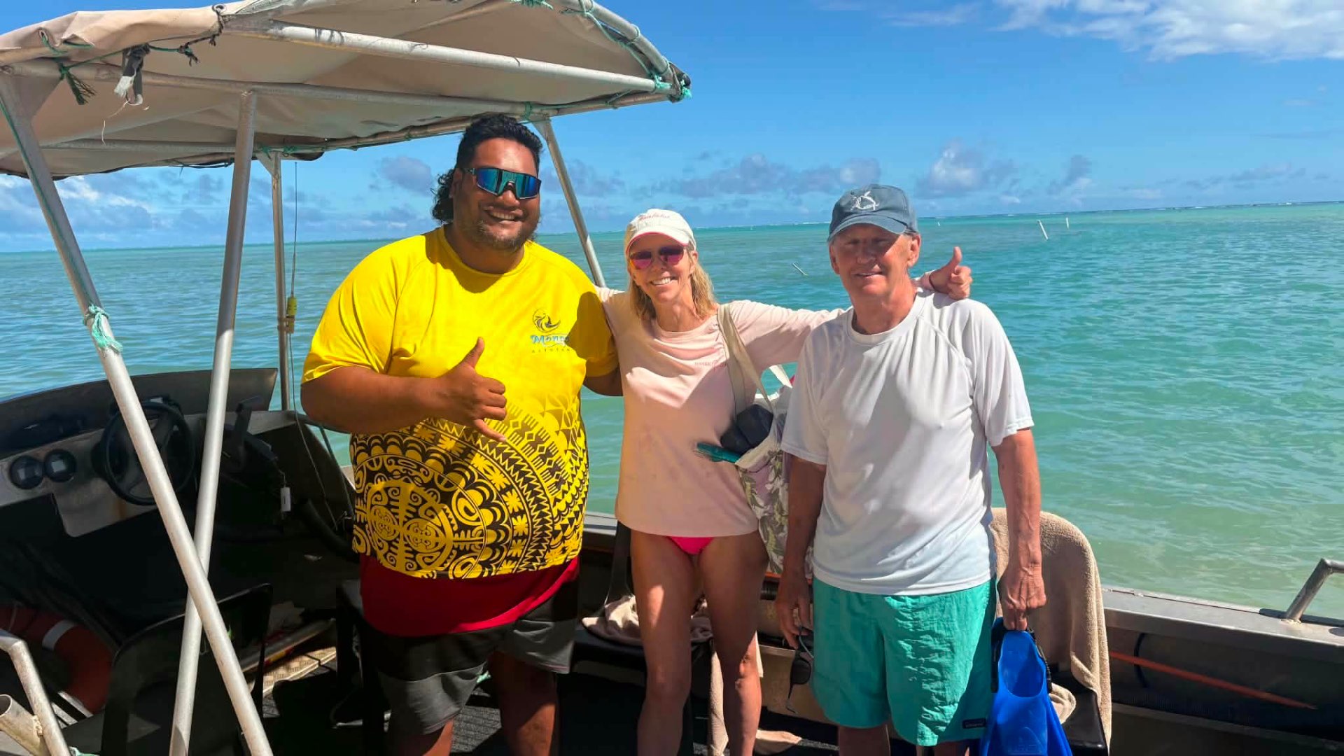 Captain Dan with happy guests aboard Mona's Water Taxi
